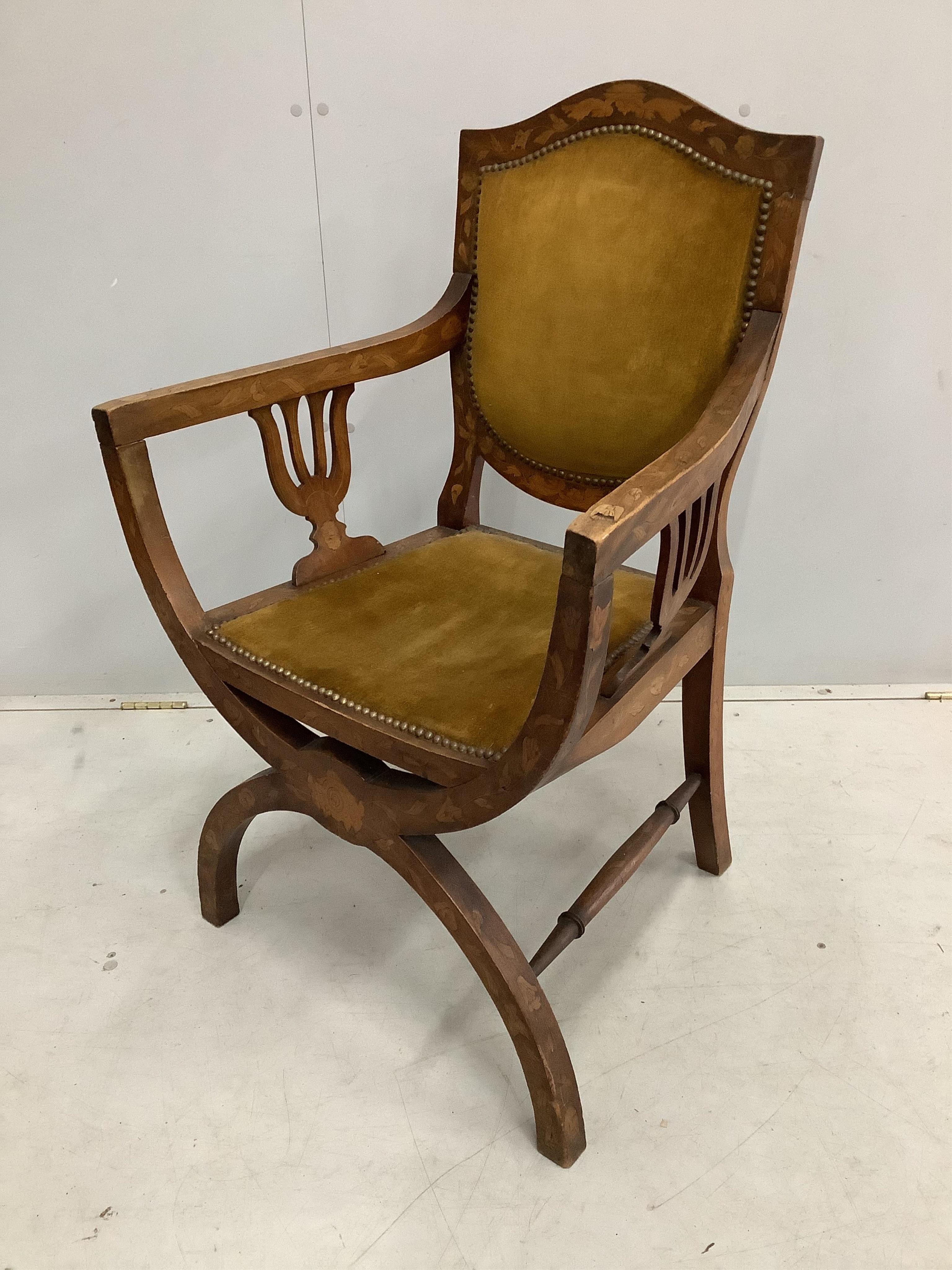 A 19th century Dutch floral marquetry inlaid X frame elbow chair, width 61cm, depth 45cm, height 94cm